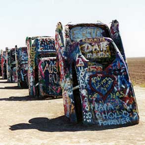 A line of cars comprise the installation Cadillac Ranch, in Amarillo, Texas
